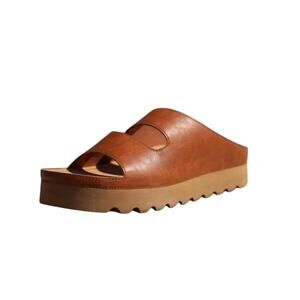 Nomad 11 Brown “Santa Cruz” cutout open slide sandals.